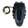 Smoked LED tail light with integrated turn signals and wiring harness