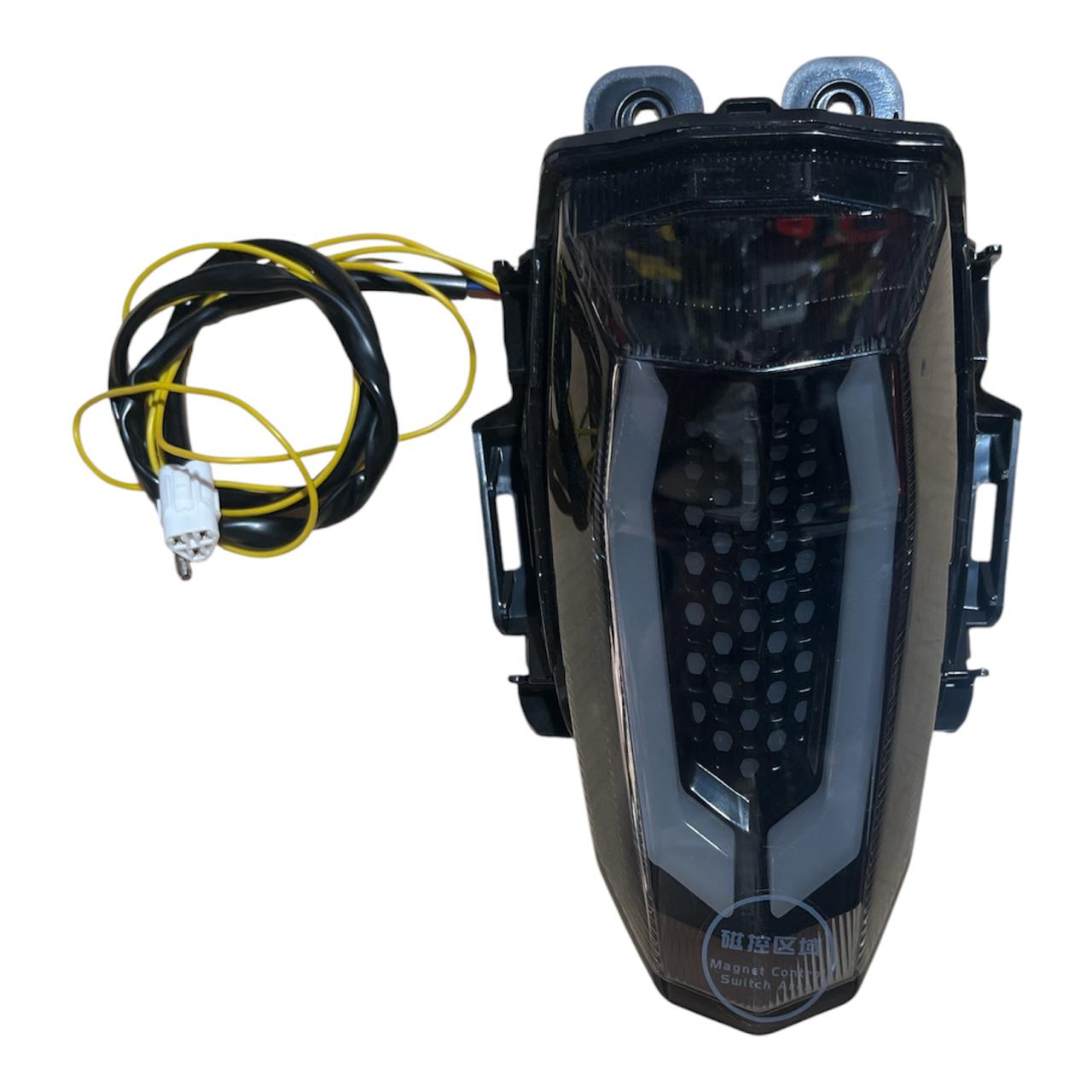 Smoked LED tail light with integrated turn signals and wiring harness